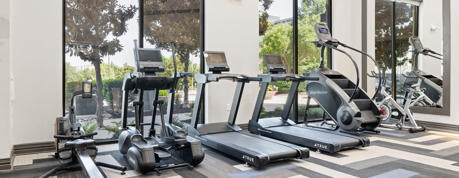 fitness center with aerobic equipment